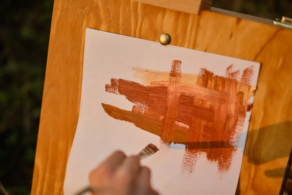 children drawing on easel